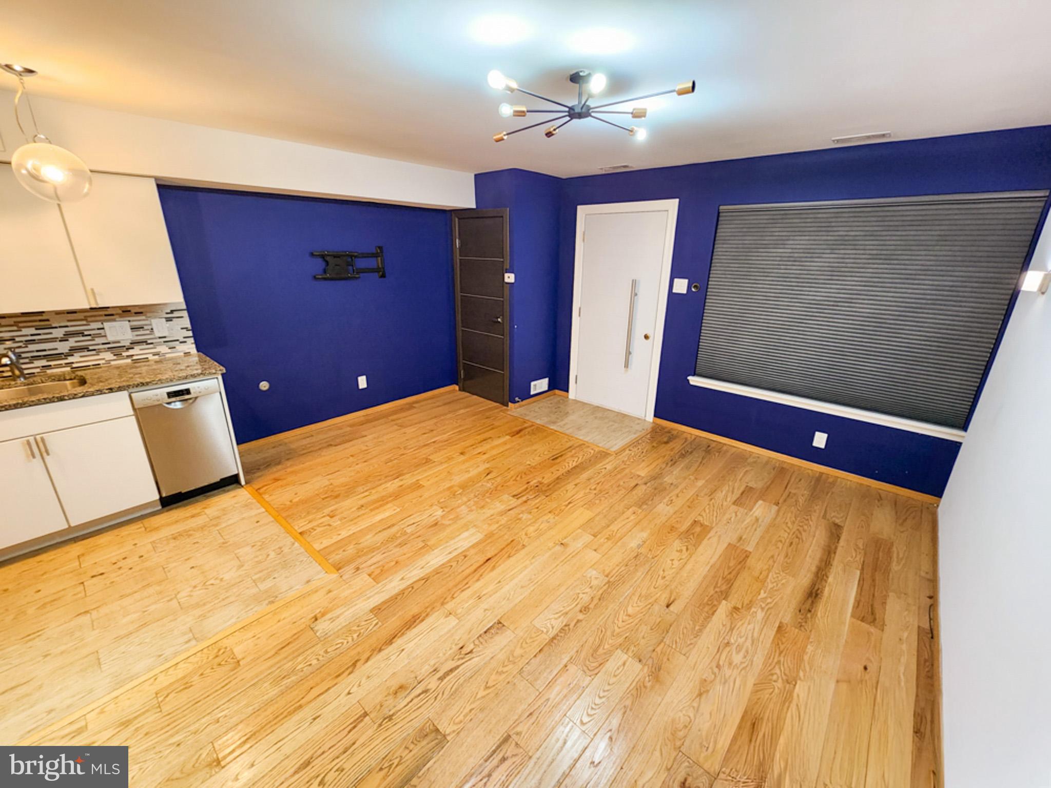 12135 Academy Road, Unit 77 Philadelphia, PA 19154 - Photo 3 of 12 a bedroom with a bed and a flat screen tv