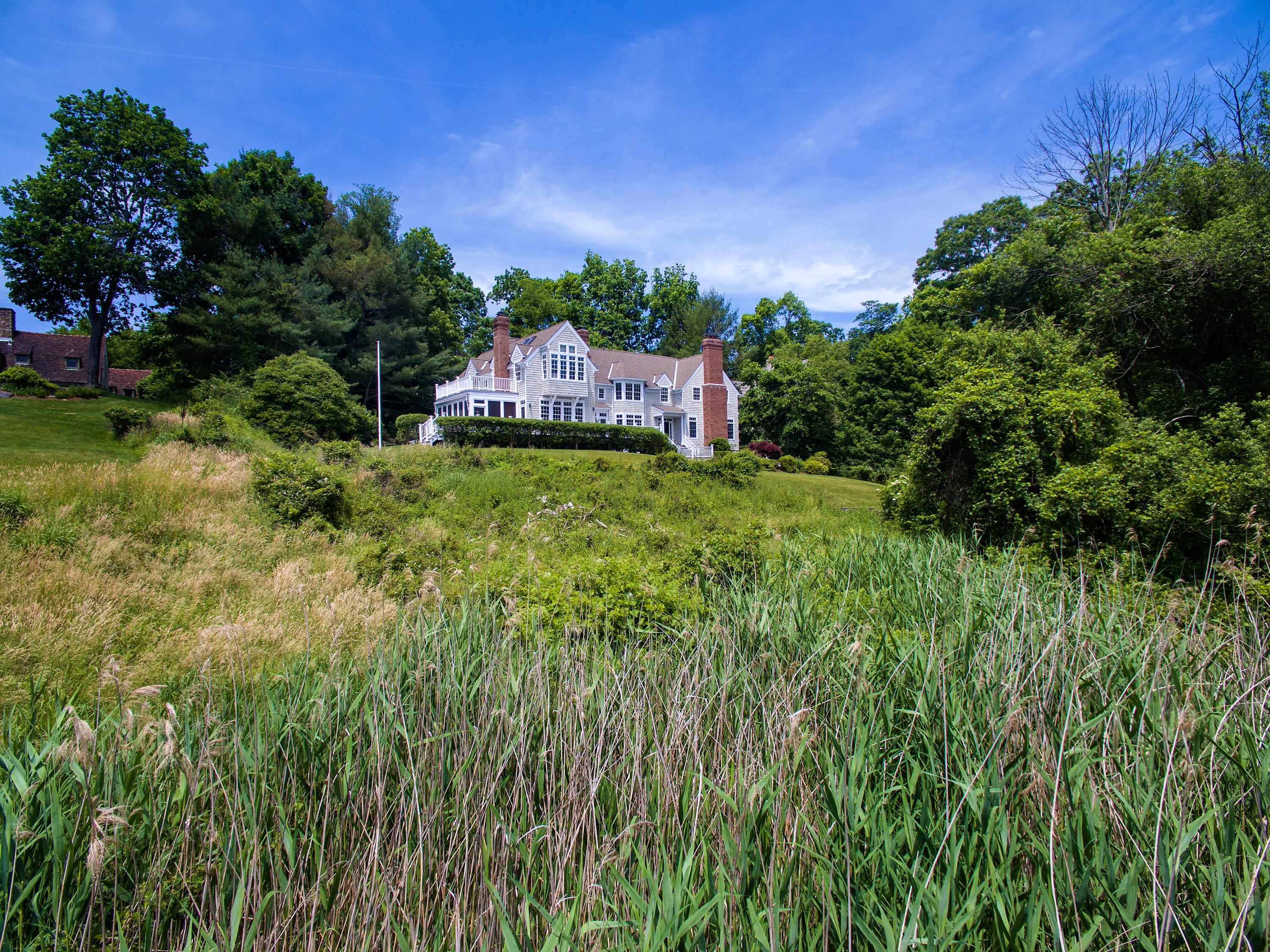 13 Valley Road Norwalk, CT 06854 - Photo 2 of 40 a backyard of a house with lots of green space