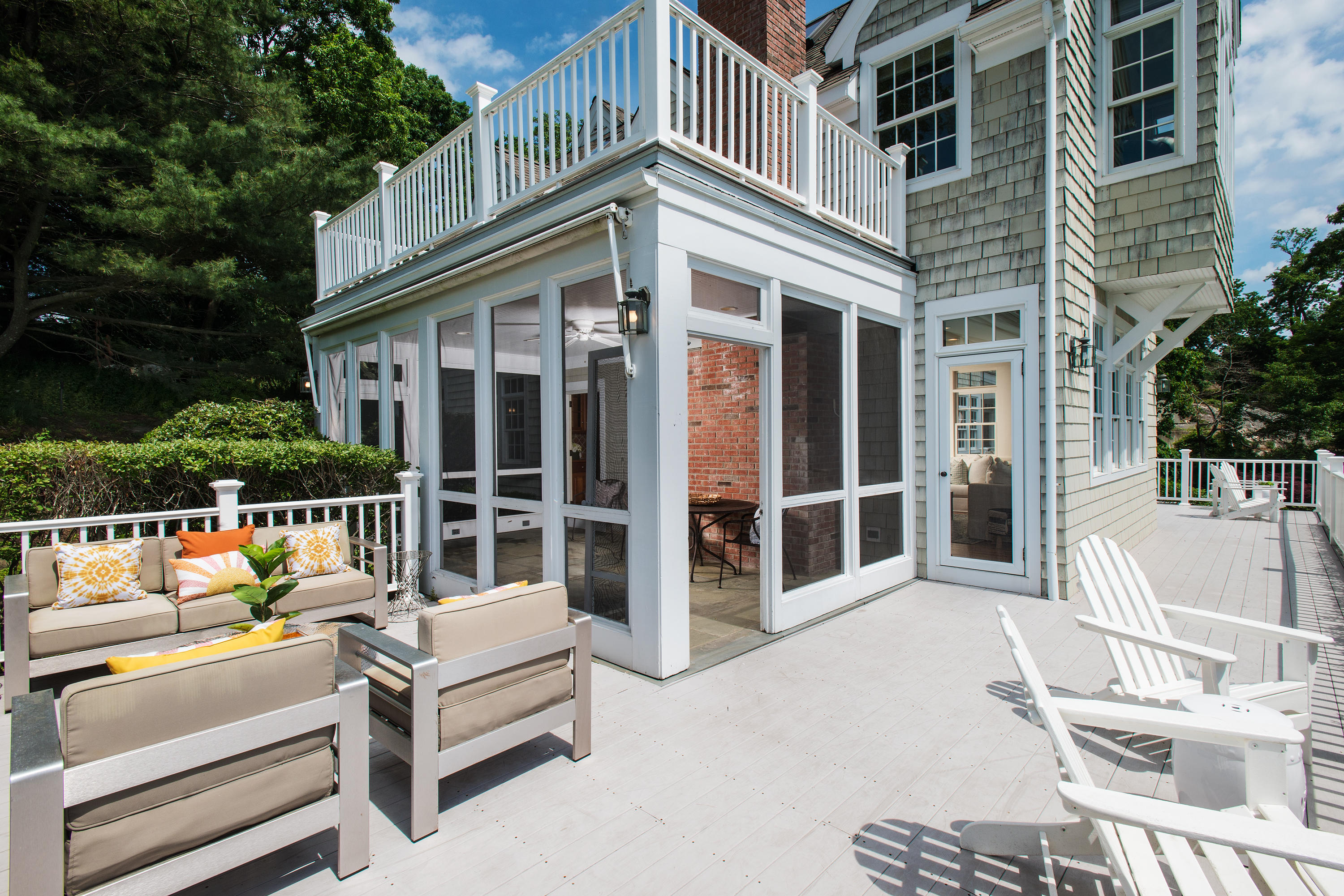 13 Valley Road Norwalk, CT 06854 - Photo 12 of 40 a view of a patio with couches table and chairs and wooden floor