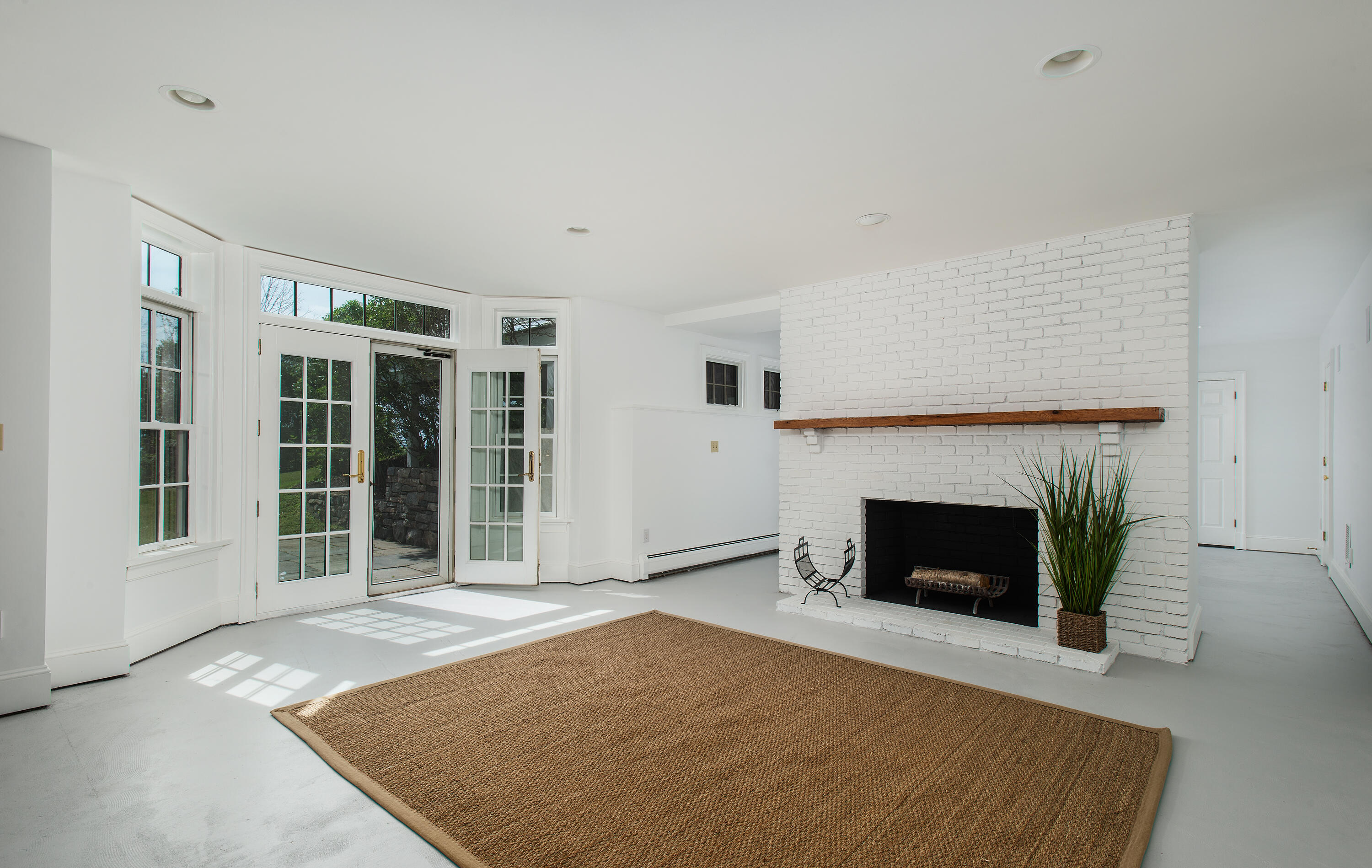 13 Valley Road Norwalk, CT 06854 - Photo 15 of 40 a view of an empty room with a window and fireplace