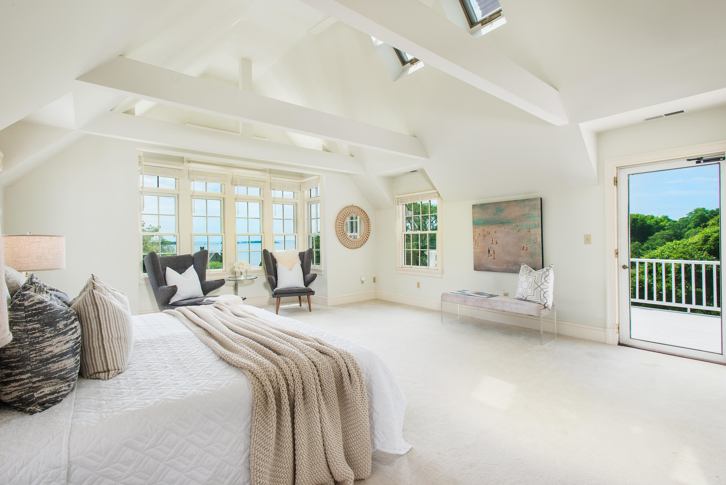 13 Valley Road Norwalk, CT 06854 - Photo 16 of 40 a bedroom with a large bed and a chandelier