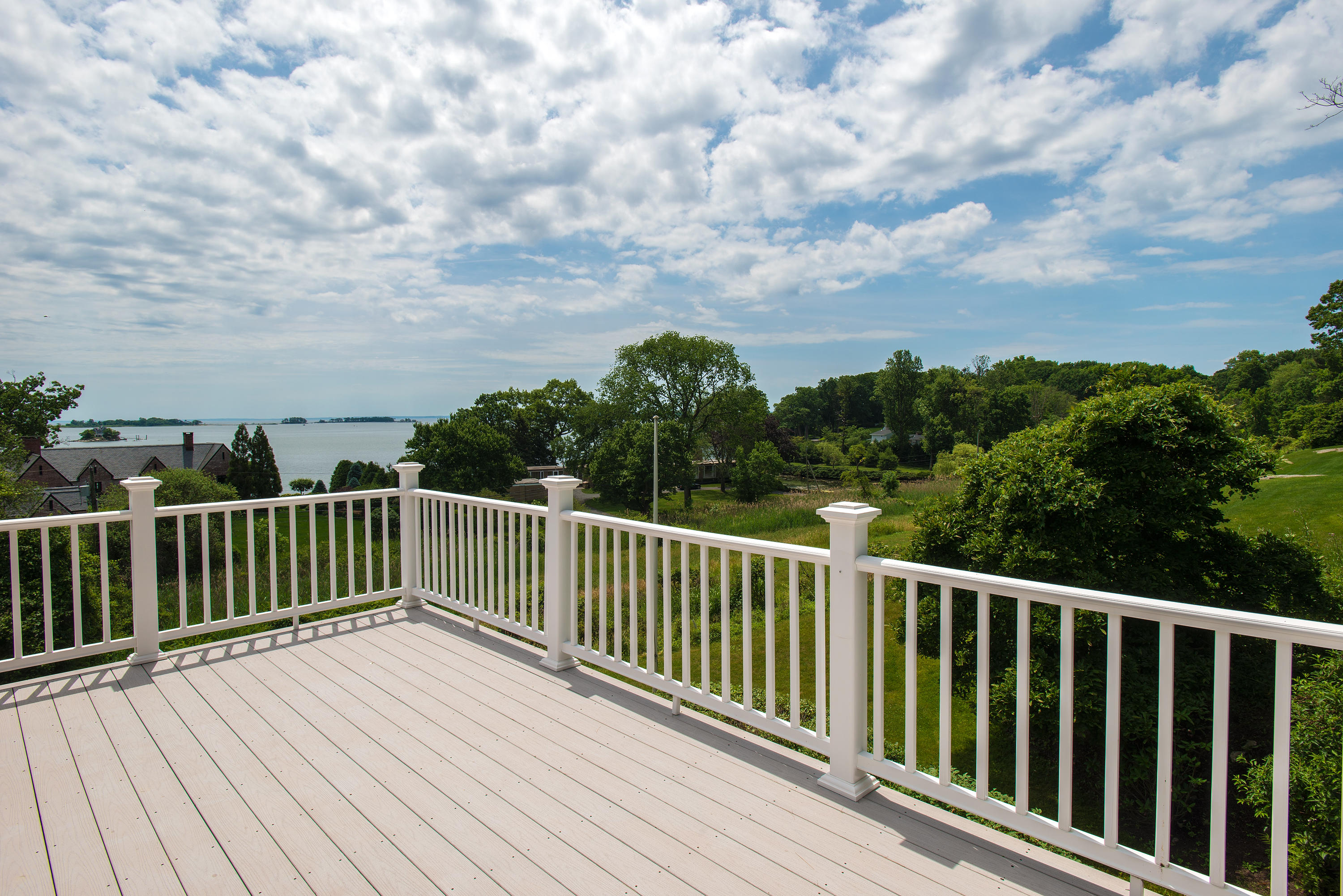 13 Valley Road Norwalk, CT 06854 - Photo 17 of 40 a view of a balcony with wooden floor and fence