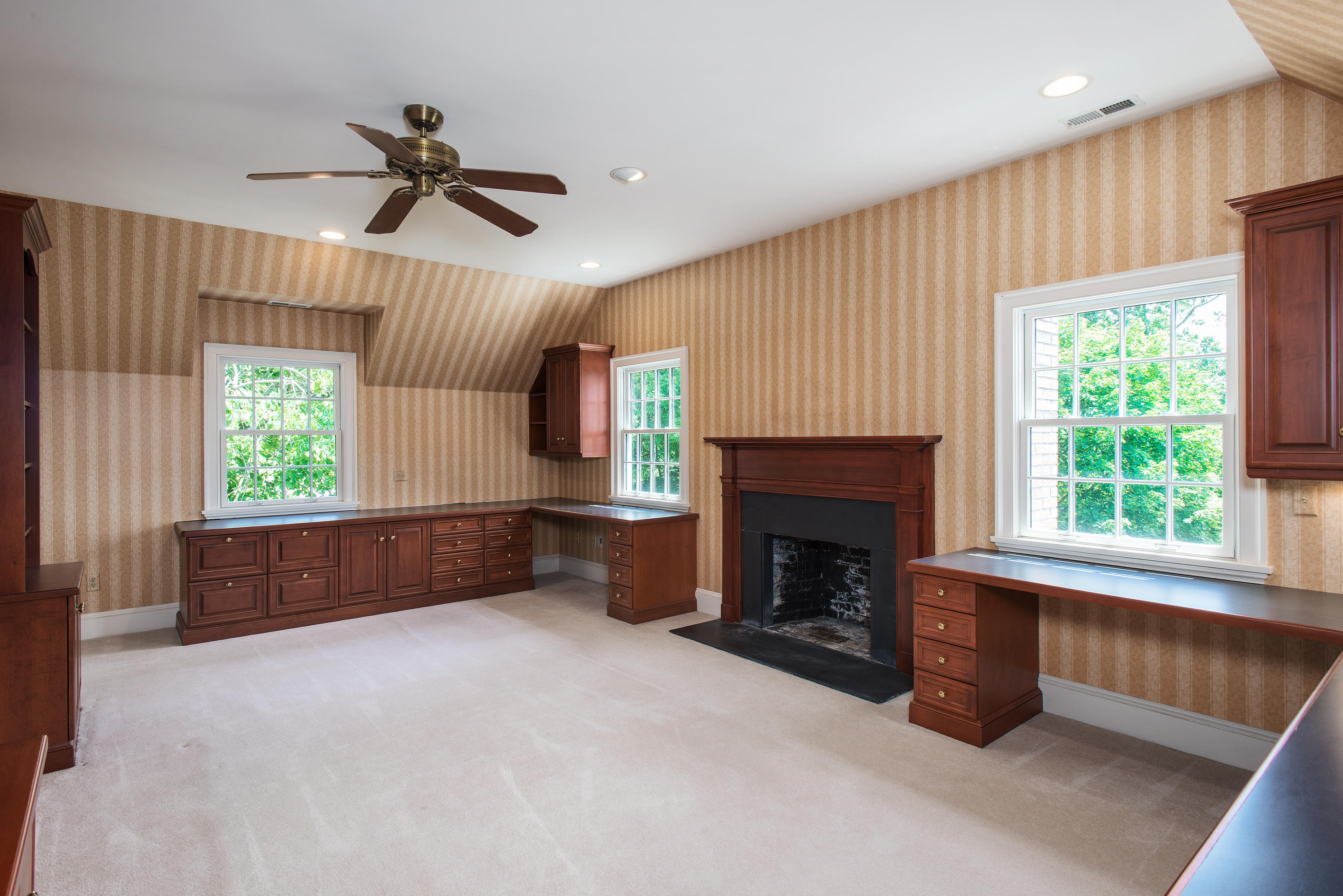 13 Valley Road Norwalk, CT 06854 - Photo 22 of 40 a living room with furniture and a fireplace
