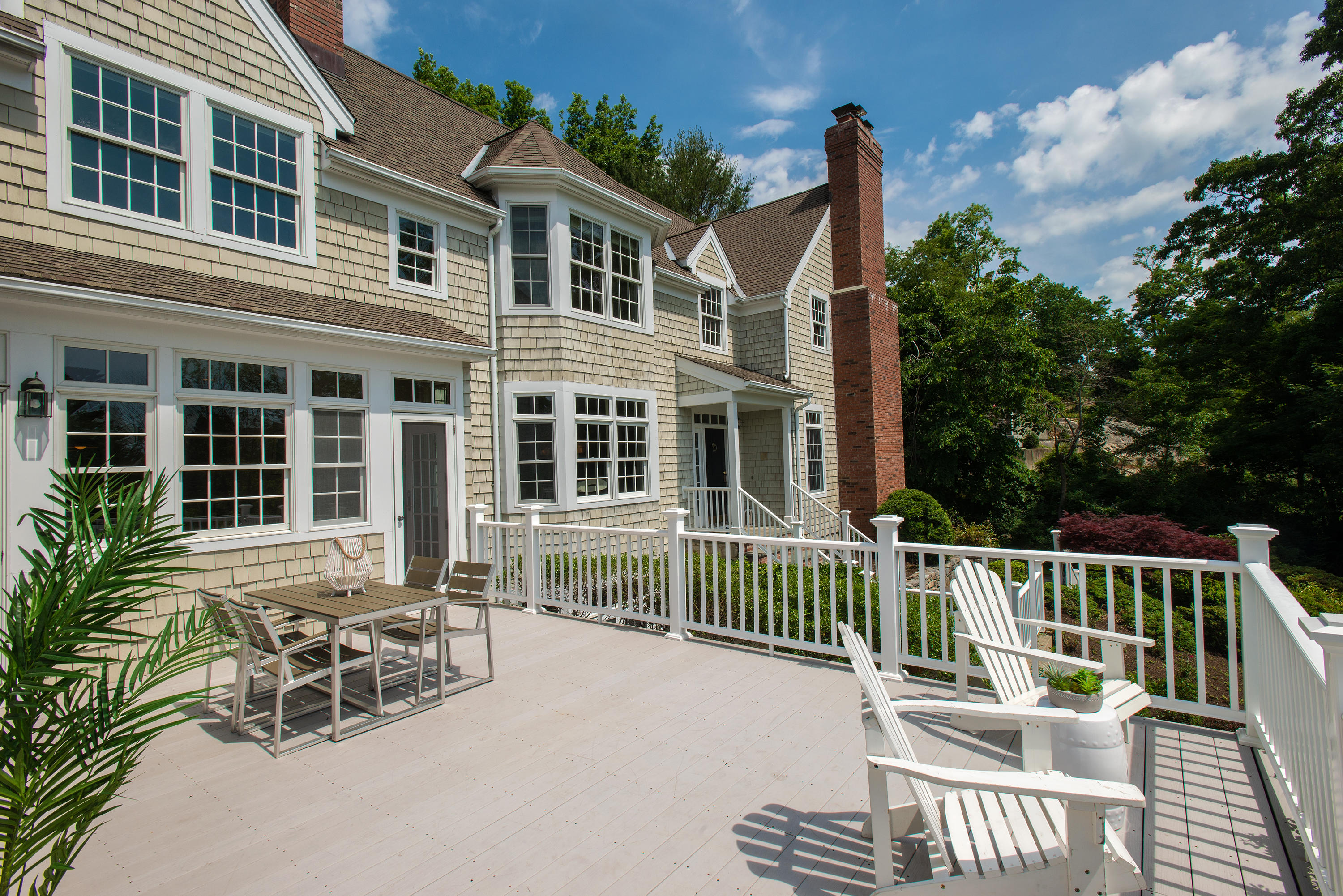 13 Valley Road Norwalk, CT 06854 - Photo 24 of 40 a view of a house with a deck and furniture