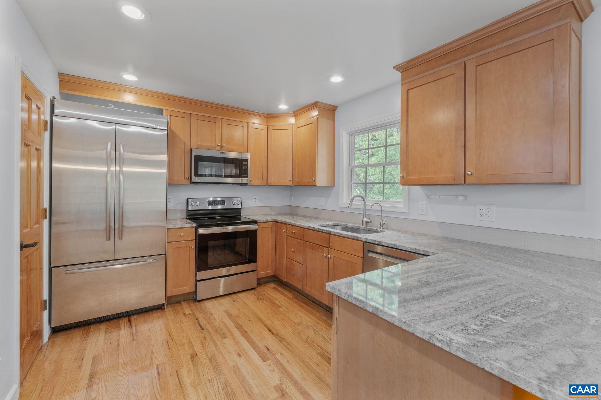 118 Roy's Place Charlottesville, VA 22902 - Photo 14 of 42 a kitchen with granite countertop a refrigerator stove and microwave