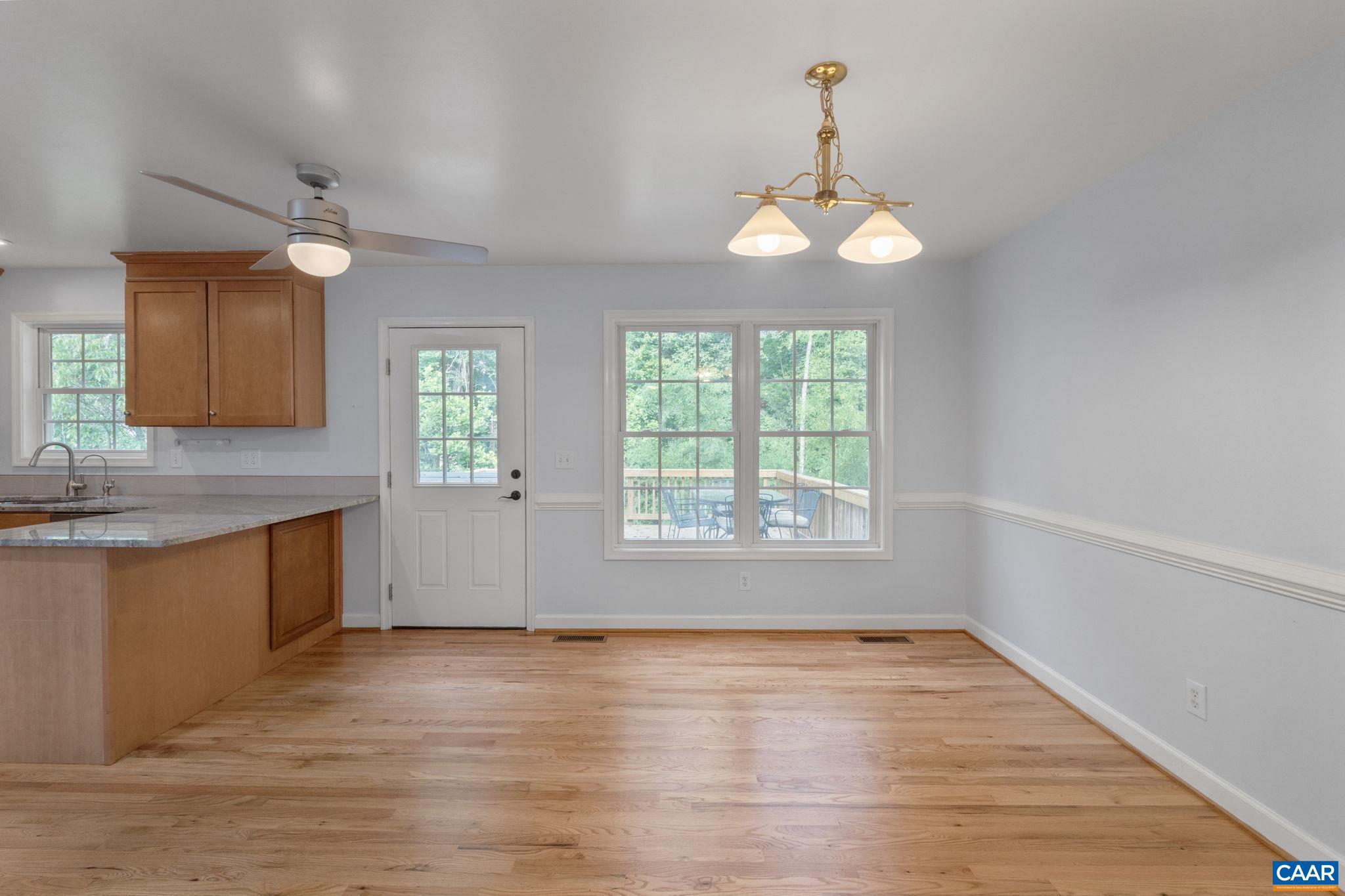 118 Roy's Place Charlottesville, VA 22902 - Photo 21 of 42 an empty room with wooden floor and windows
