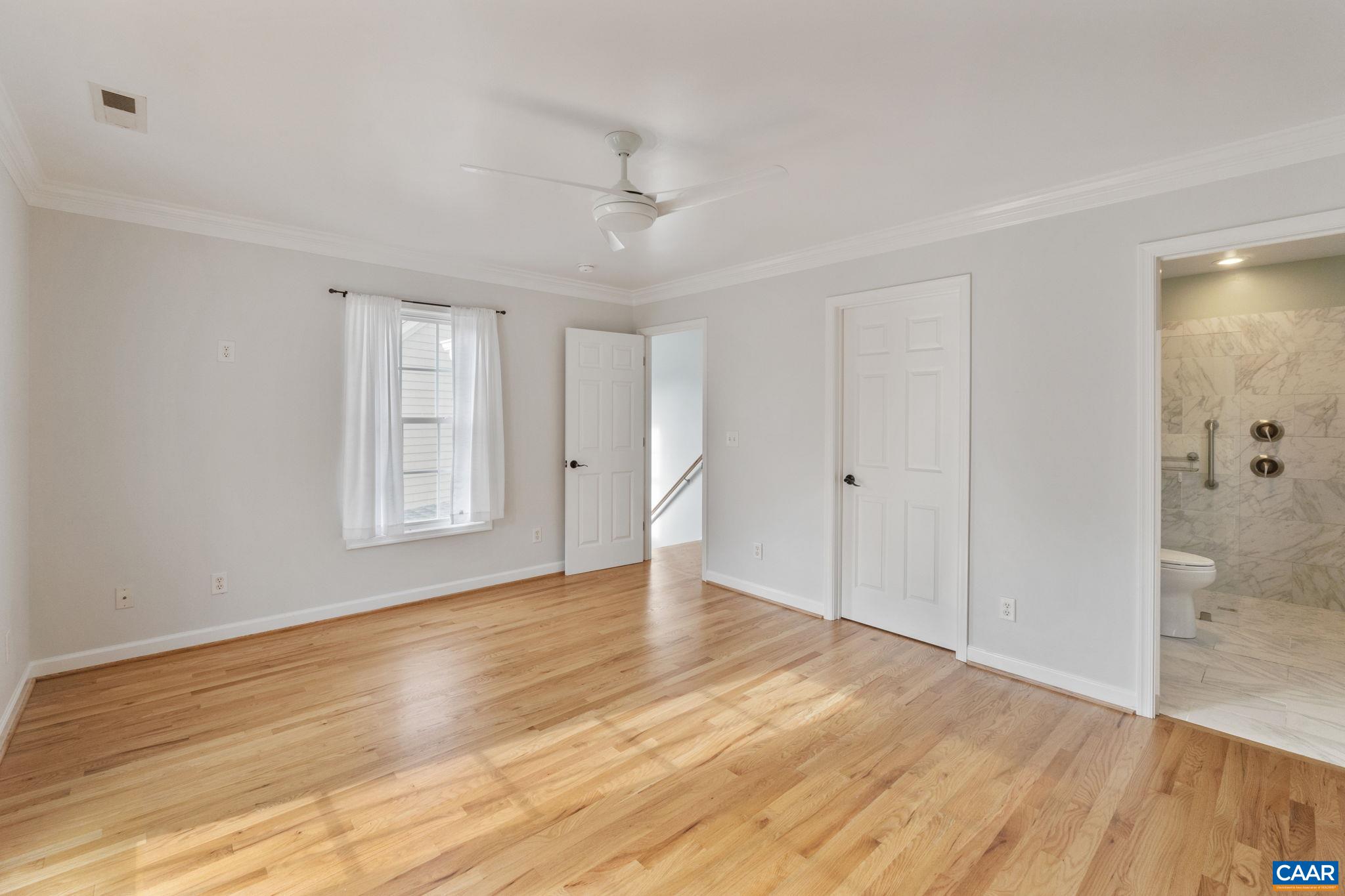 118 Roy's Place Charlottesville, VA 22902 - Photo 27 of 42 a view of empty room with wooden floor and fan