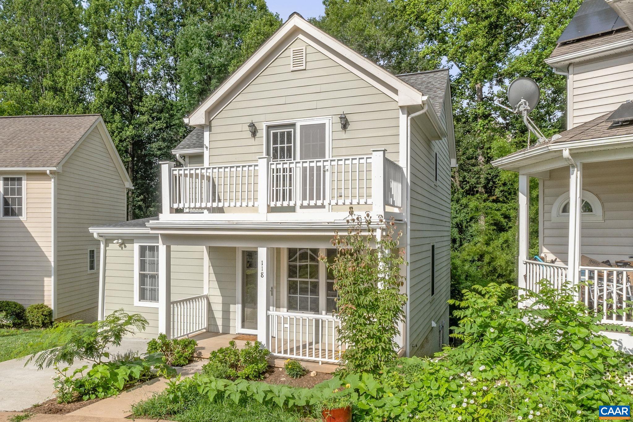 118 Roy's Place Charlottesville, VA 22902 - Photo 3 of 42 a view of a house with a yard and potted plants