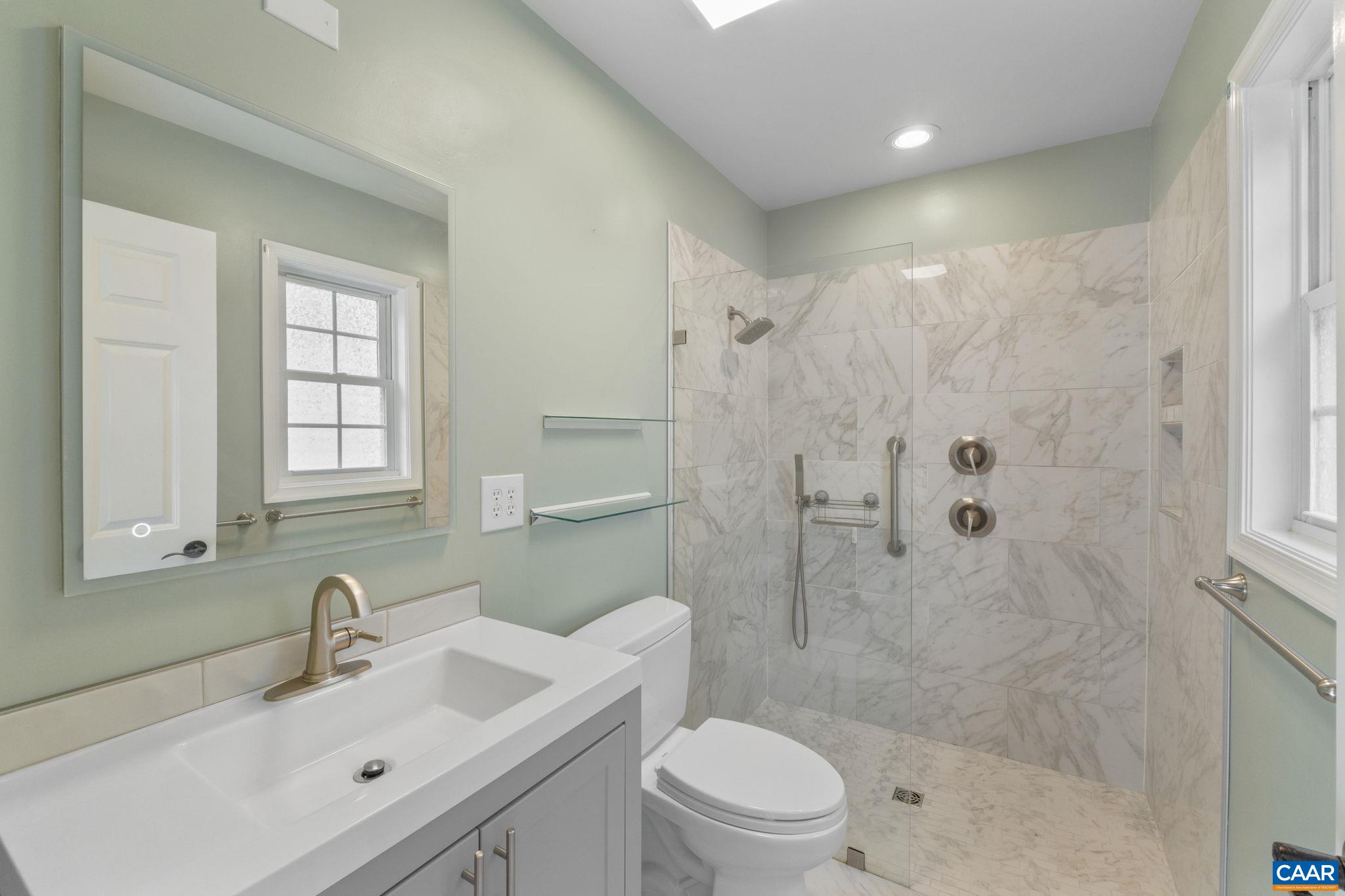 118 Roy's Place Charlottesville, VA 22902 - Photo 7 of 42 a bathroom with a sink a toilet and shower