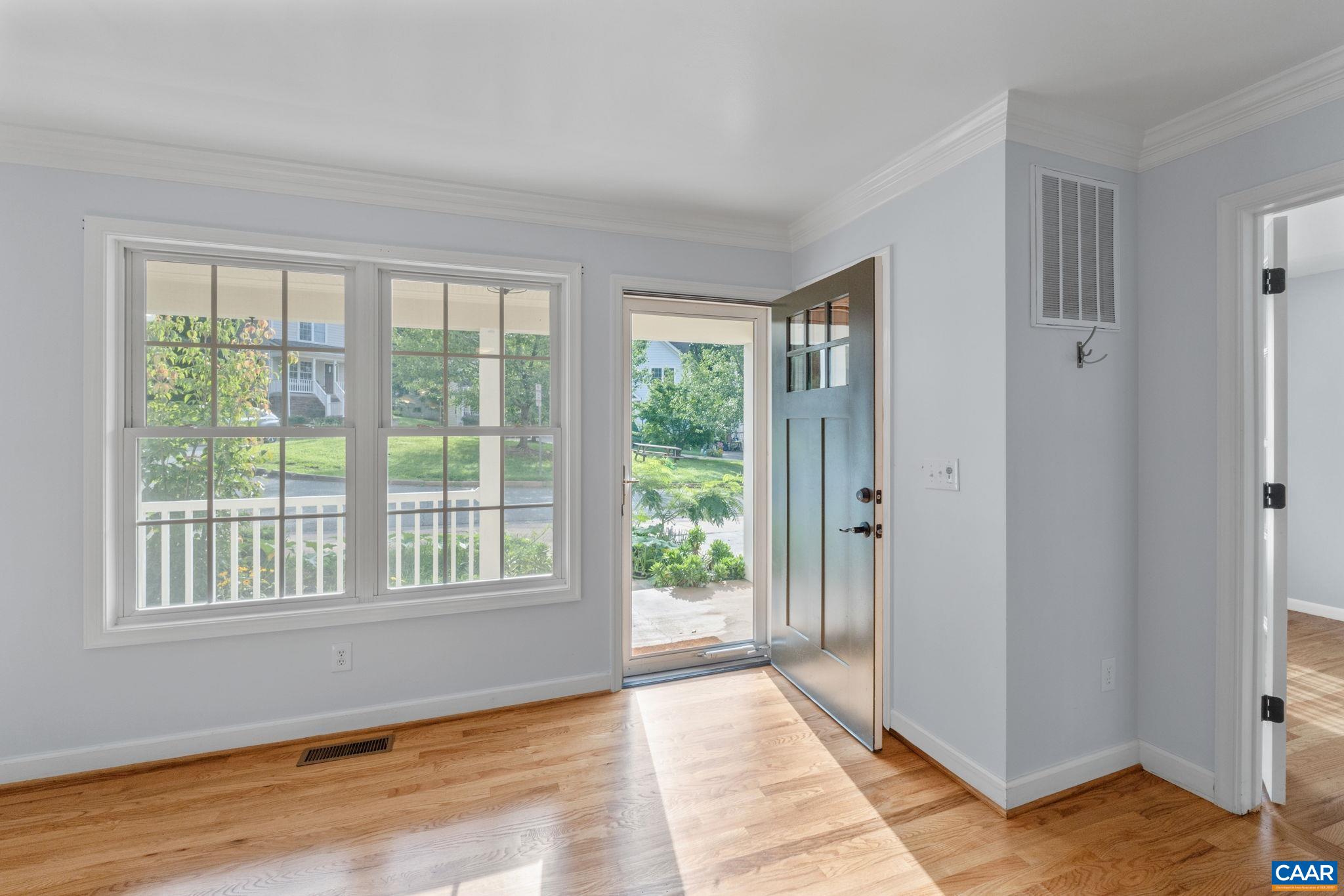 118 Roy's Place Charlottesville, VA 22902 - Photo 8 of 42 a view of an empty room with wooden floor and windows