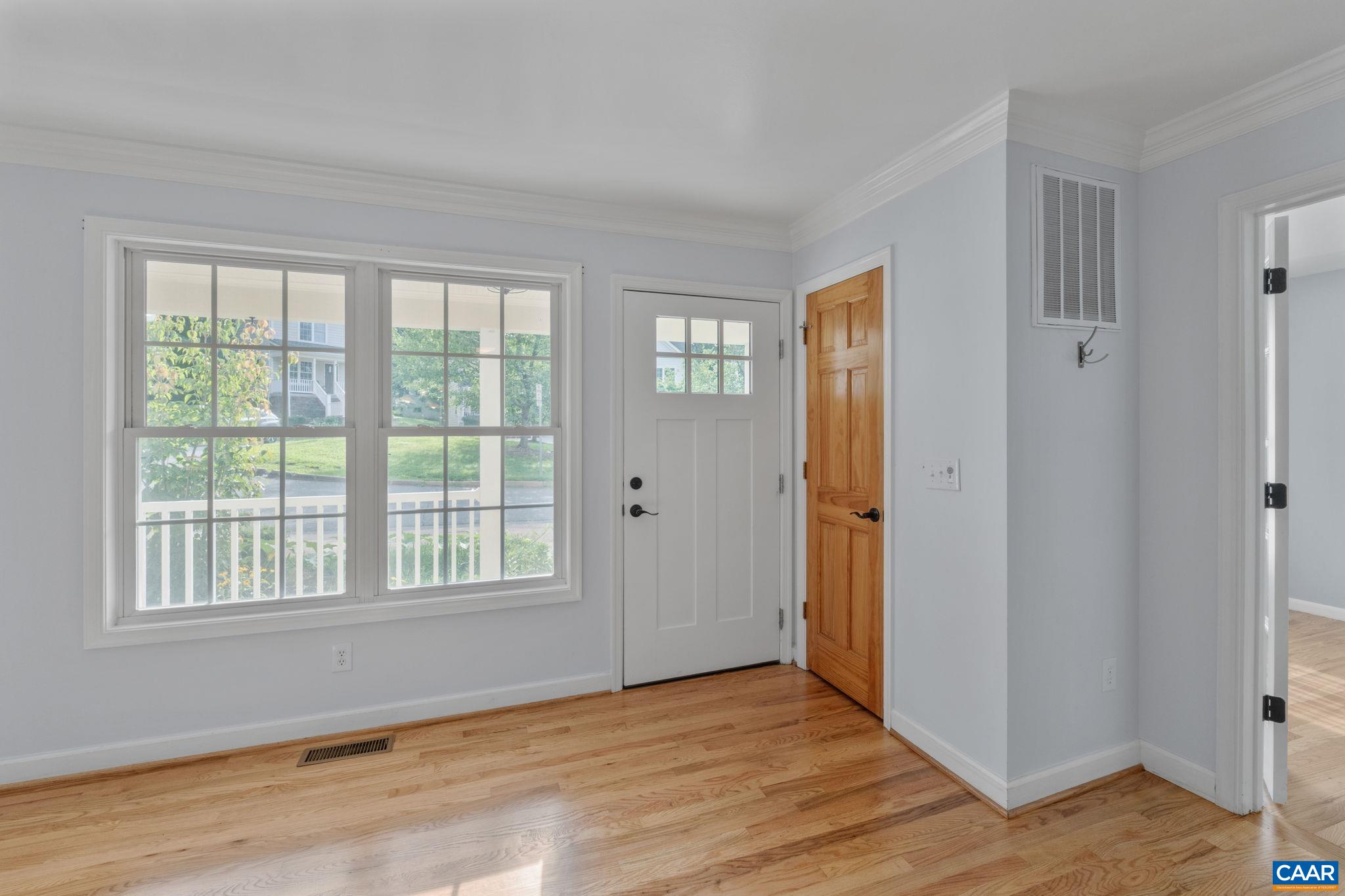 118 Roy's Place Charlottesville, VA 22902 - Photo 9 of 42 a view of an empty room with wooden floor and a window