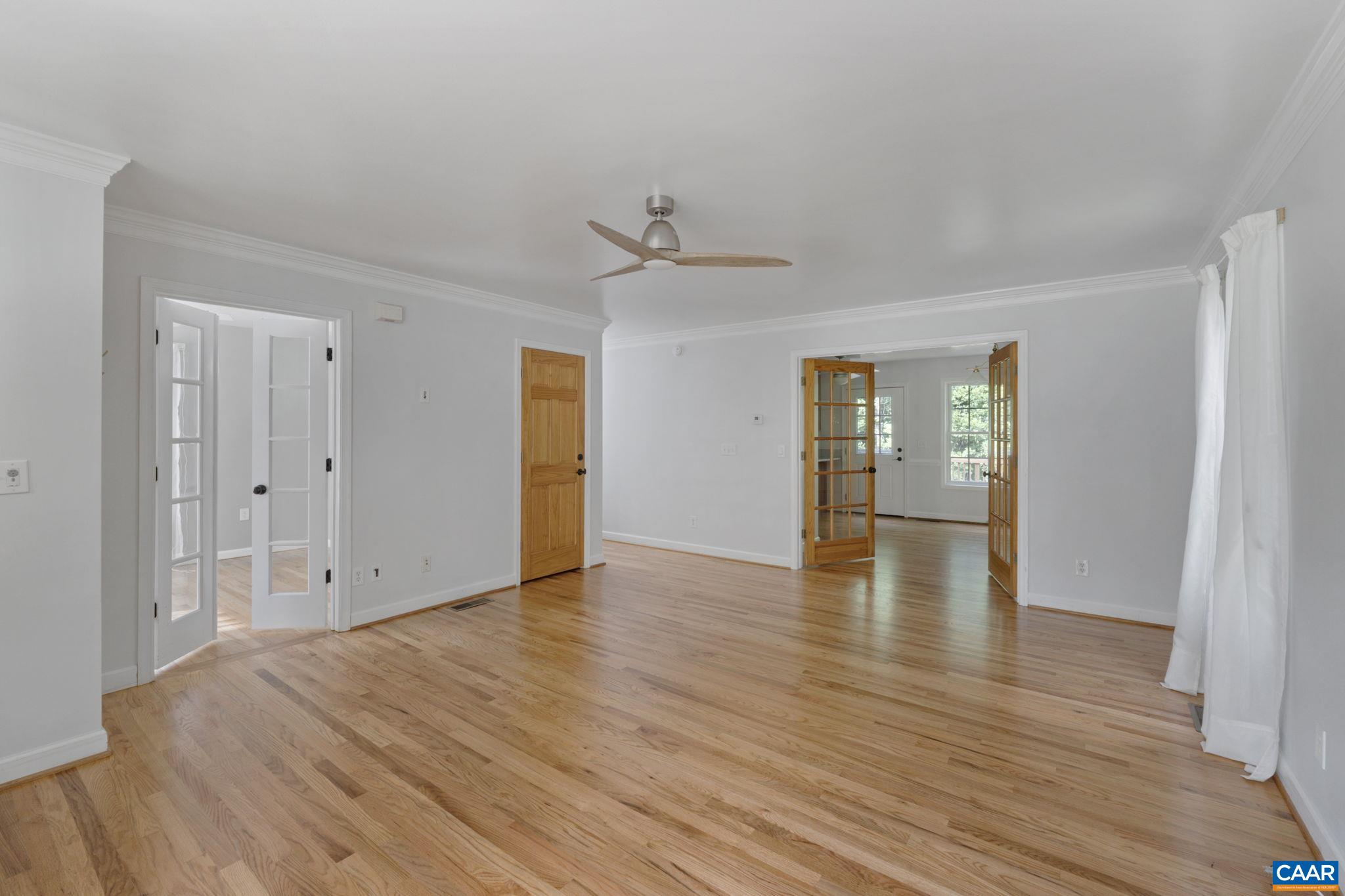 118 Roy's Place Charlottesville, VA 22902 - Photo 10 of 42 a view of an empty room with wooden floor and a ceiling fan