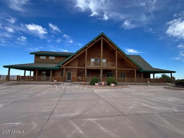 a front view of a house with sitting area