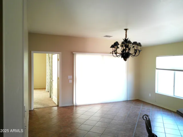 a view of a hallway with a chandelier
