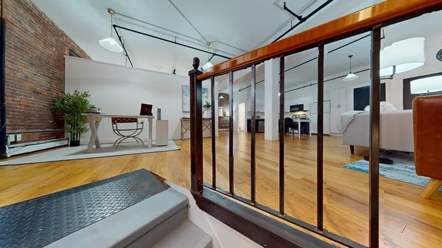 a view of swimming pool with seating area