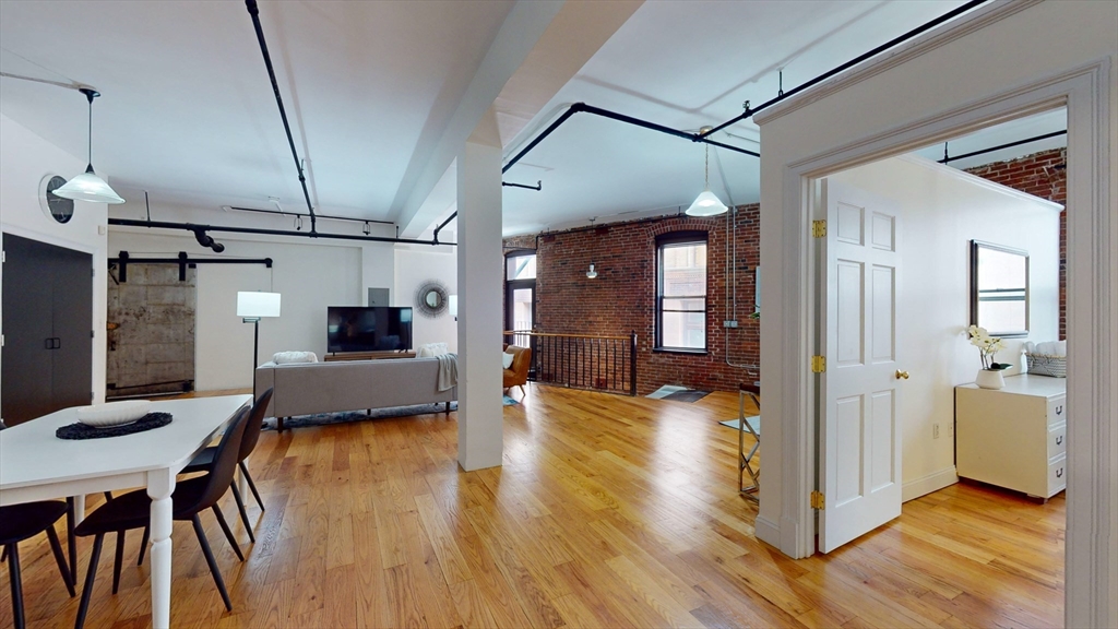 19 Stanhope Street, Unit 2B Boston, MA 02116 - Photo 8 of 15 a view of a living room and a wooden floor