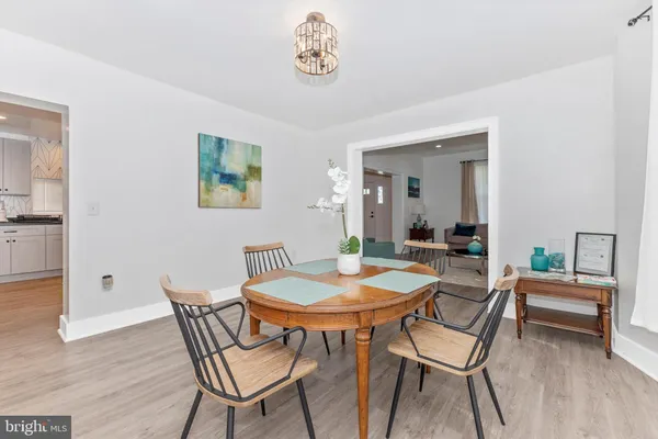 a view of a dining room with furniture and a table