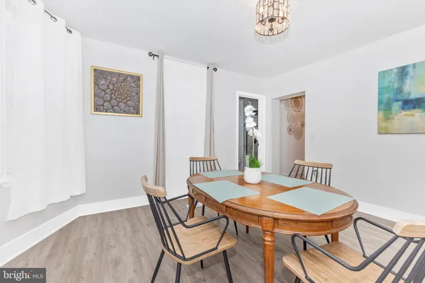 a view of a dining room with furniture and a table