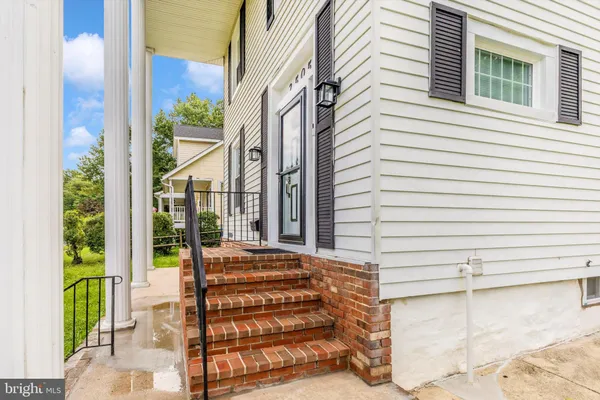 a view of a house with a door and a window