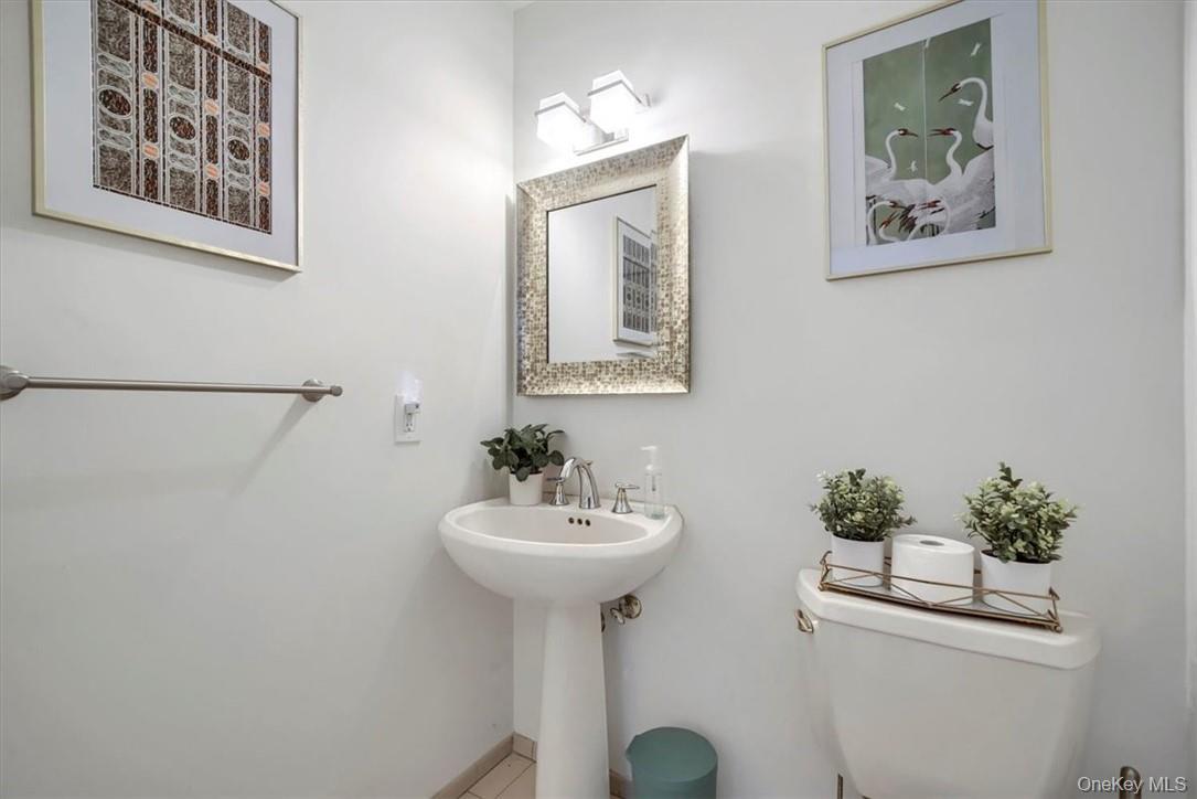 10 High Tor Road New City, NY 10956 - Photo 12 of 33 a bathroom with a sink and a mirror