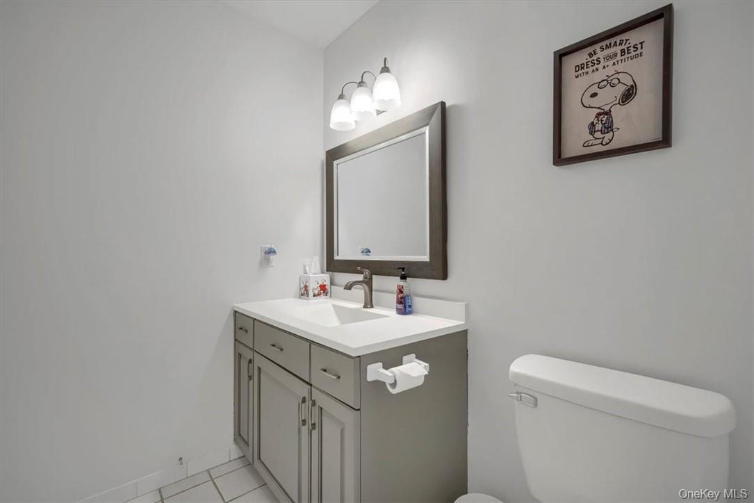 10 High Tor Road New City, NY 10956 - Photo 21 of 33 a bathroom with a sink a toilet and mirror