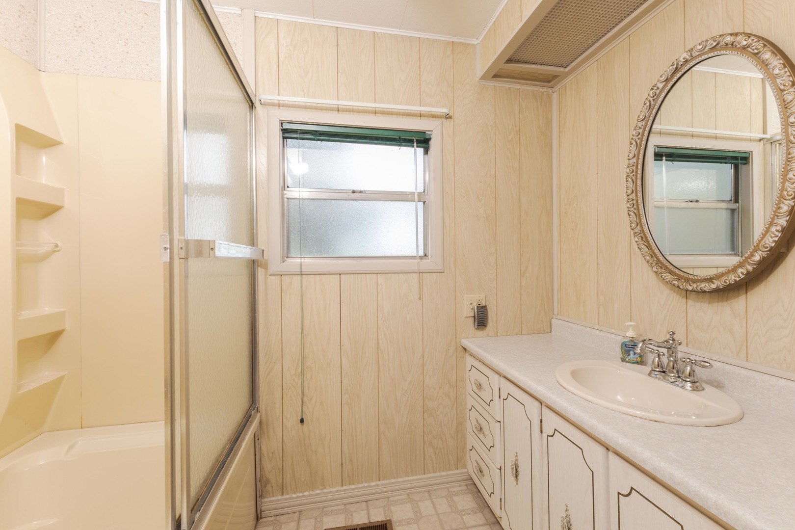 502 South Union Street Dwight, IL 60420 - Photo 30 of 47 a bathroom with a sink a toilet and a mirror