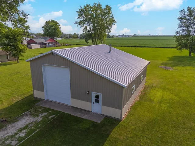 a aerial view of a house with a yard