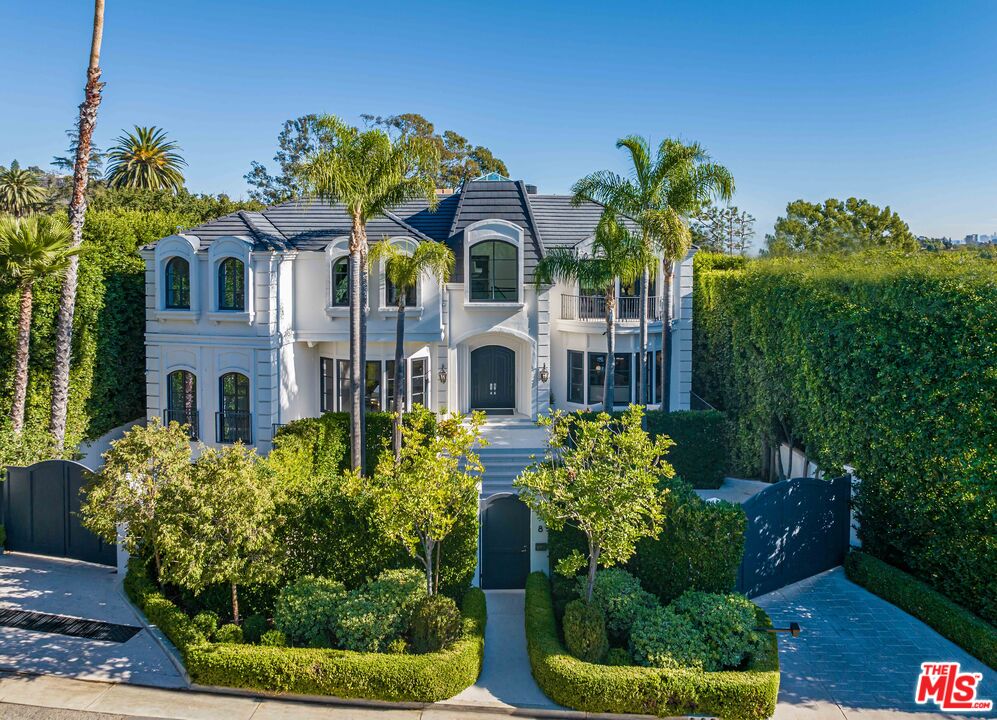 a front view of house with yard and outdoor seating