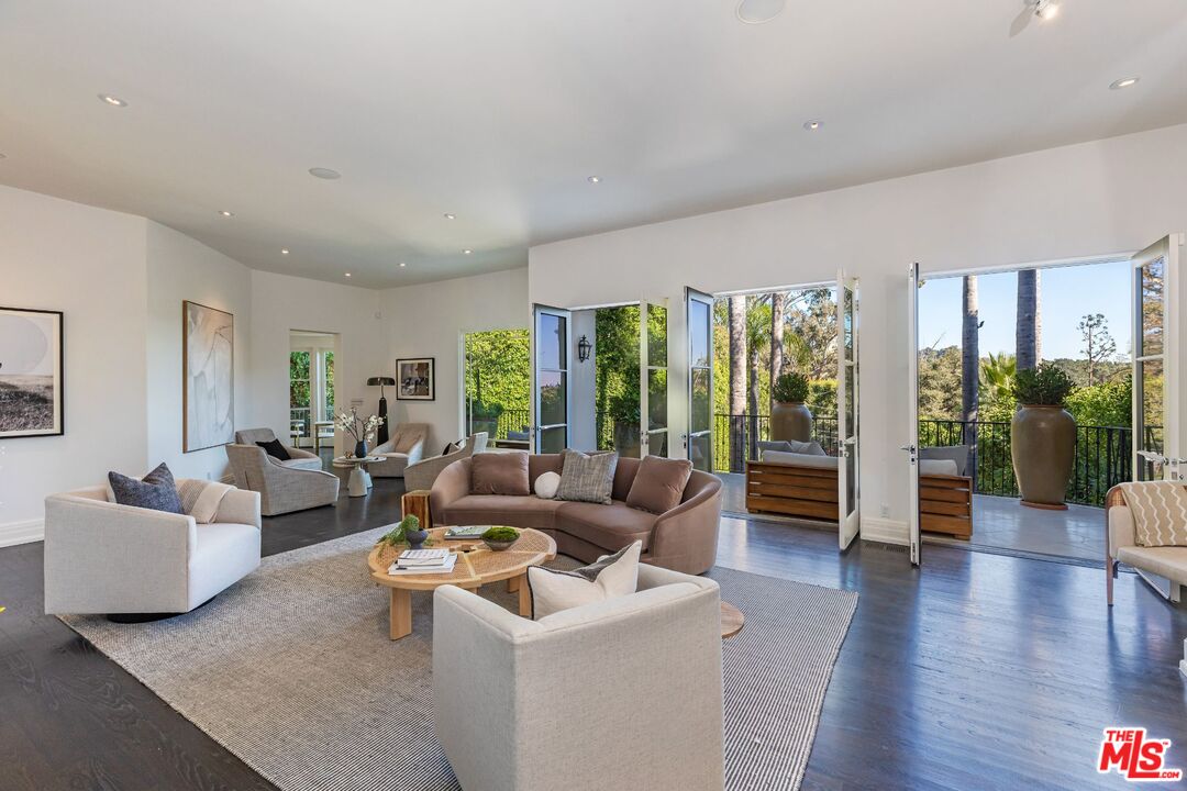 8 Oakmont Drive Los Angeles, CA 90049 - Photo 11 of 46 a living room with furniture and wooden floor