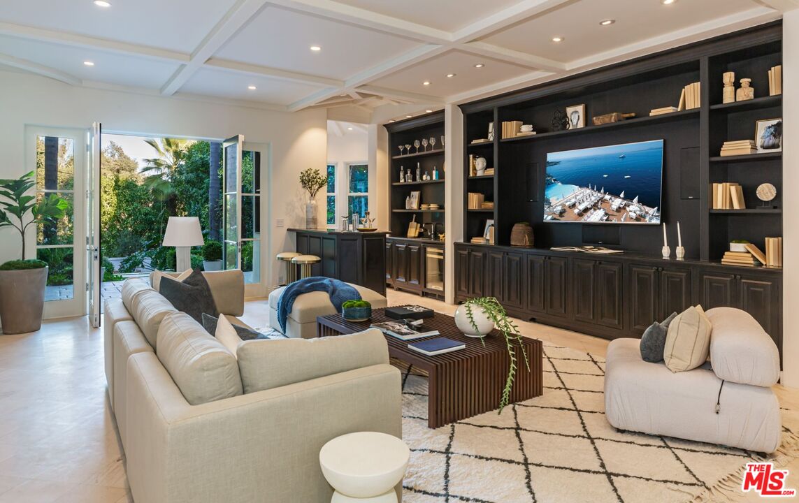 8 Oakmont Drive Los Angeles, CA 90049 - Photo 19 of 46 a living room with furniture and a flat screen tv