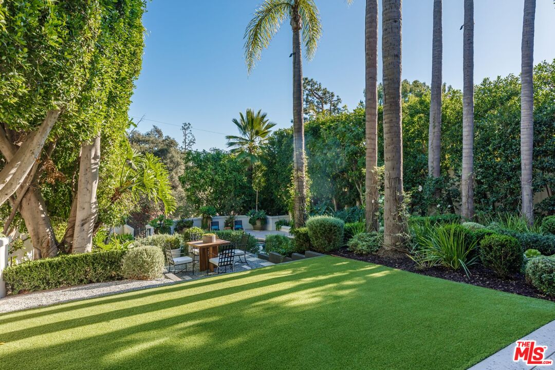 8 Oakmont Drive Los Angeles, CA 90049 - Photo 22 of 46 a garden view with a fountain