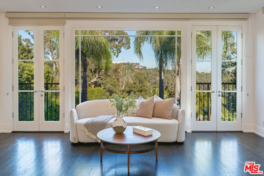 8 Oakmont Drive Los Angeles, CA 90049 - Photo 27 of 46 a living room with furniture and a large window