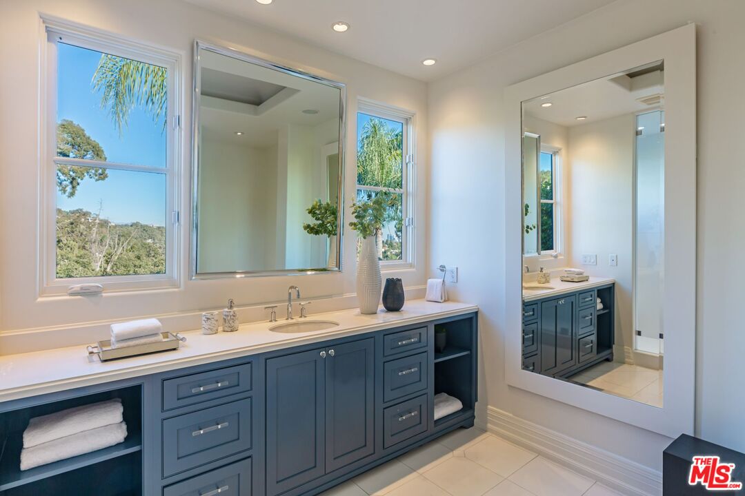 8 Oakmont Drive Los Angeles, CA 90049 - Photo 30 of 46 a bathroom with a sink double vanity and a mirror