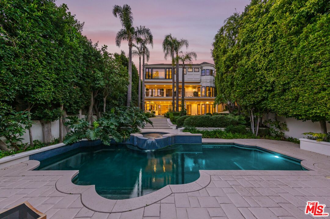 8 Oakmont Drive Los Angeles, CA 90049 - Photo 34 of 46 a front view of a house with a garden