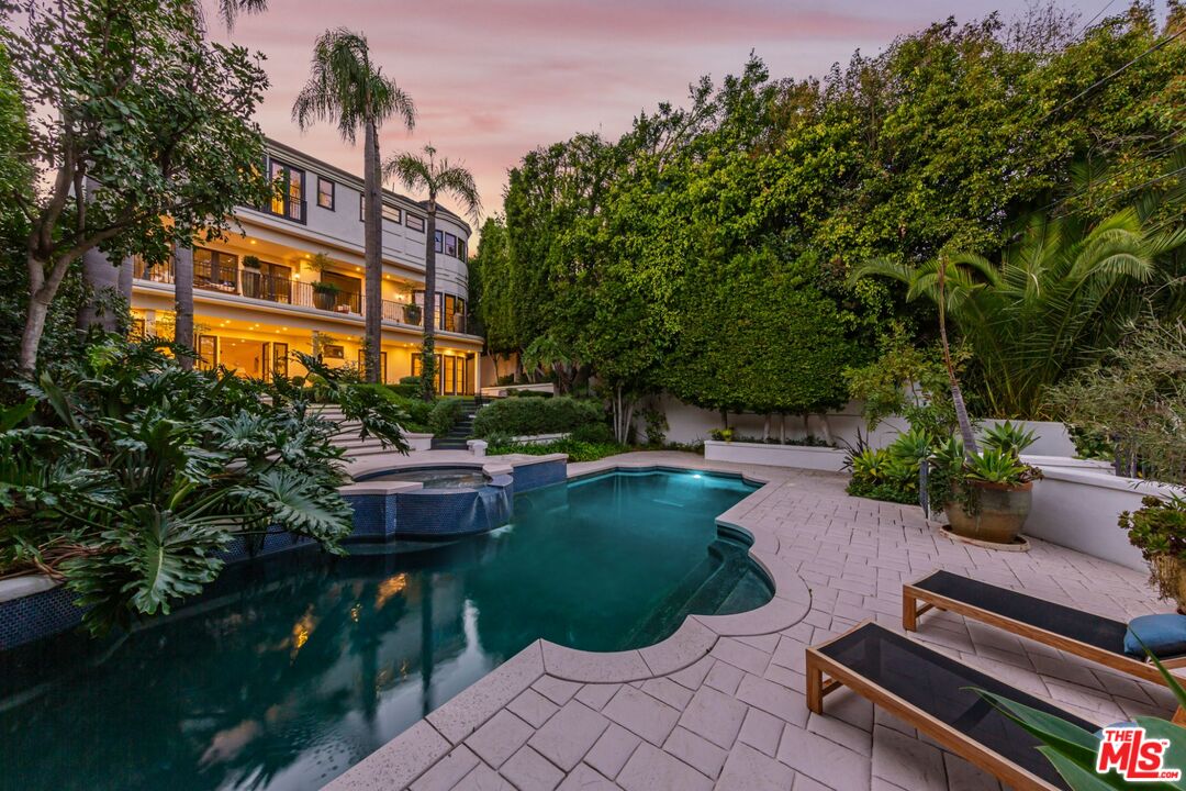 8 Oakmont Drive Los Angeles, CA 90049 - Photo 35 of 46 a front view of a house with a garden