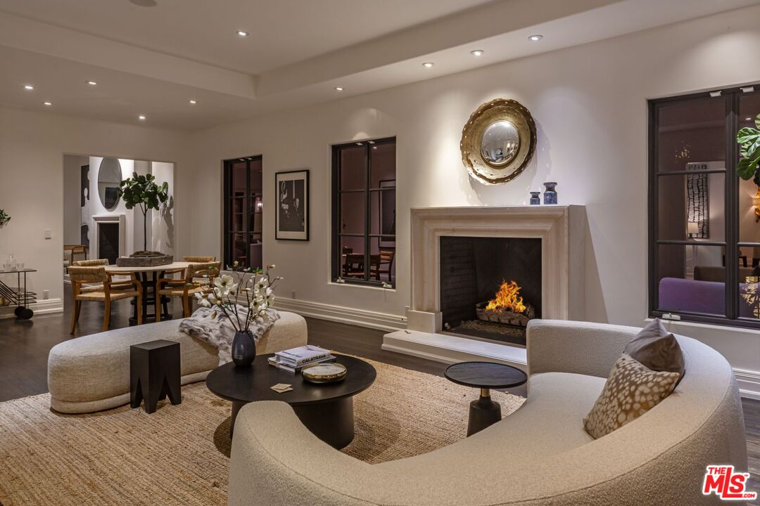 8 Oakmont Drive Los Angeles, CA 90049 - Photo 36 of 46 a living room with furniture and a fireplace