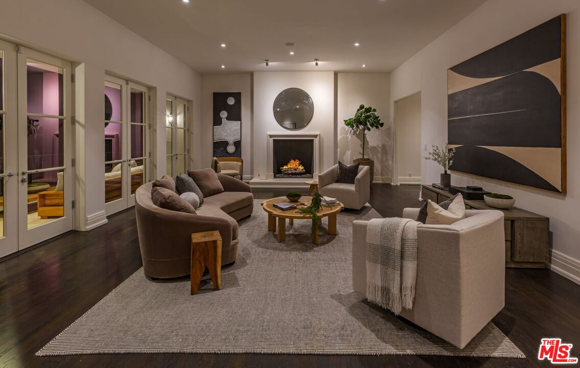 8 Oakmont Drive Los Angeles, CA 90049 - Photo 39 of 46 a living room with fireplace furniture and a flat screen tv