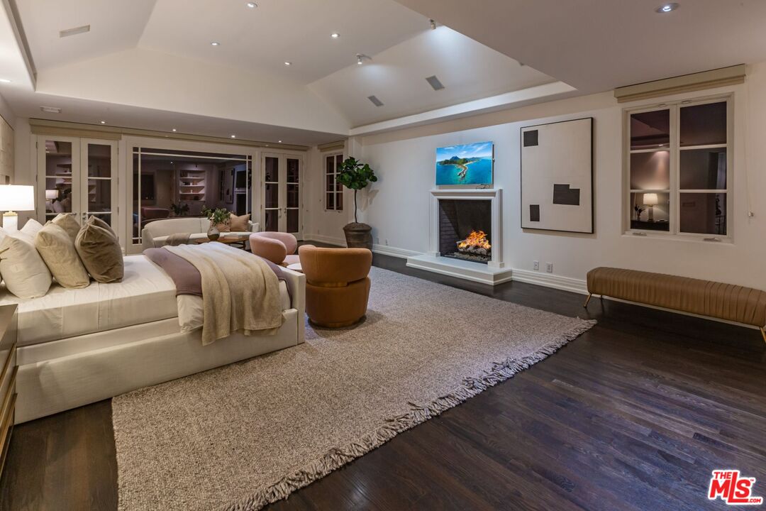 8 Oakmont Drive Los Angeles, CA 90049 - Photo 42 of 46 a living room with furniture and a fireplace