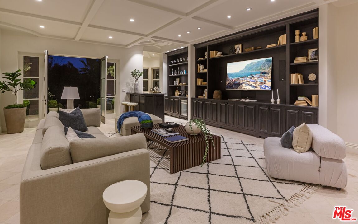 8 Oakmont Drive Los Angeles, CA 90049 - Photo 43 of 46 a living room with furniture and a flat screen tv