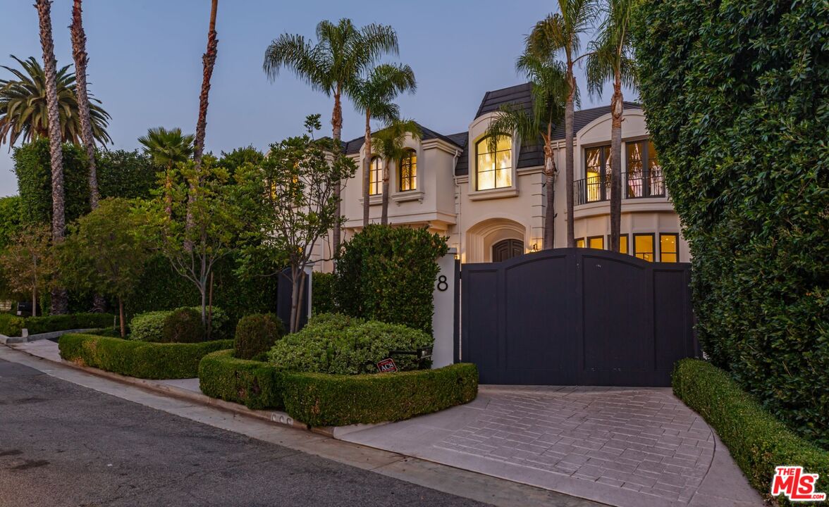 8 Oakmont Drive Los Angeles, CA 90049 - Photo 46 of 46 front view of house with a yard and potted plants