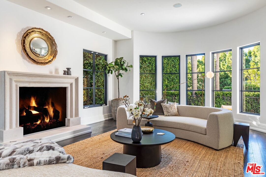 8 Oakmont Drive Los Angeles, CA 90049 - Photo 7 of 46 a living room with furniture and a fireplace