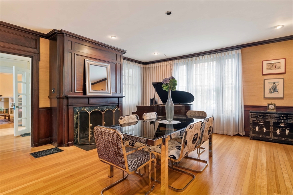 285 Clinton Road Brookline, MA 02245 - Photo 13 of 28 a dining room with furniture and wooden floor
