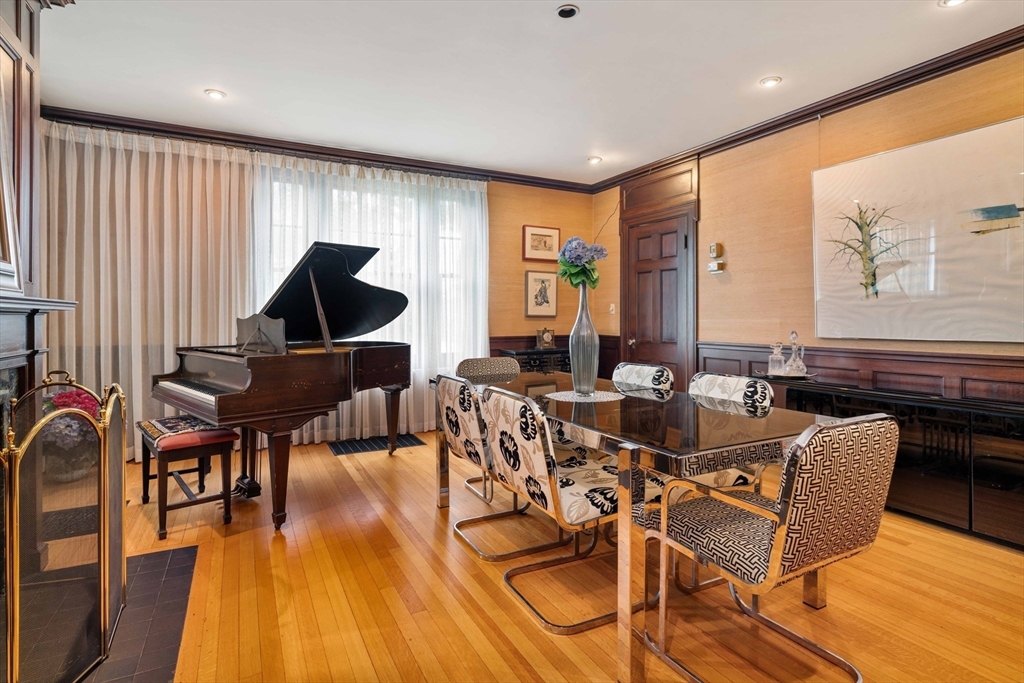 285 Clinton Road Brookline, MA 02245 - Photo 14 of 28 a view of a dining room with furniture window and wooden floor