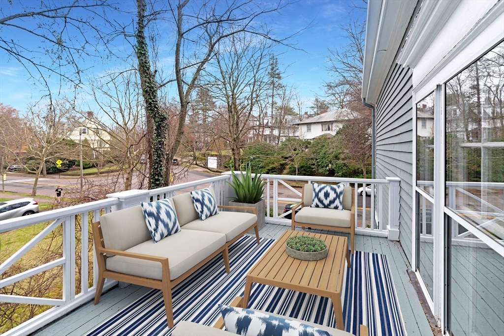 285 Clinton Road Brookline, MA 02245 - Photo 15 of 28 a view of a balcony with wooden floor and outdoor seating
