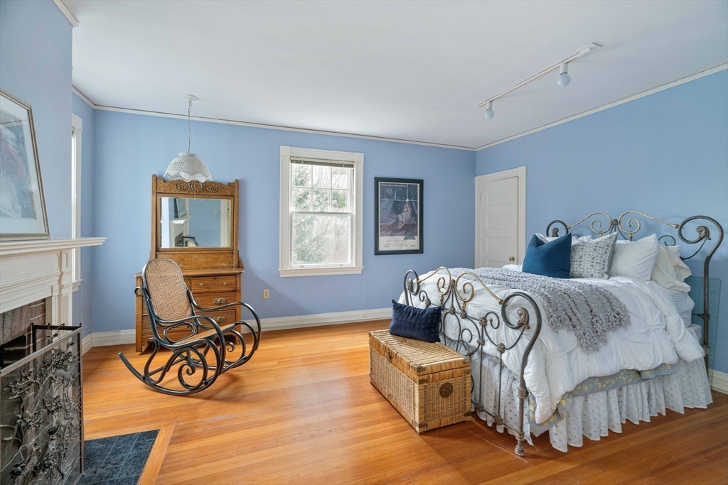 285 Clinton Road Brookline, MA 02245 - Photo 18 of 28 a bedroom with furniture and a window