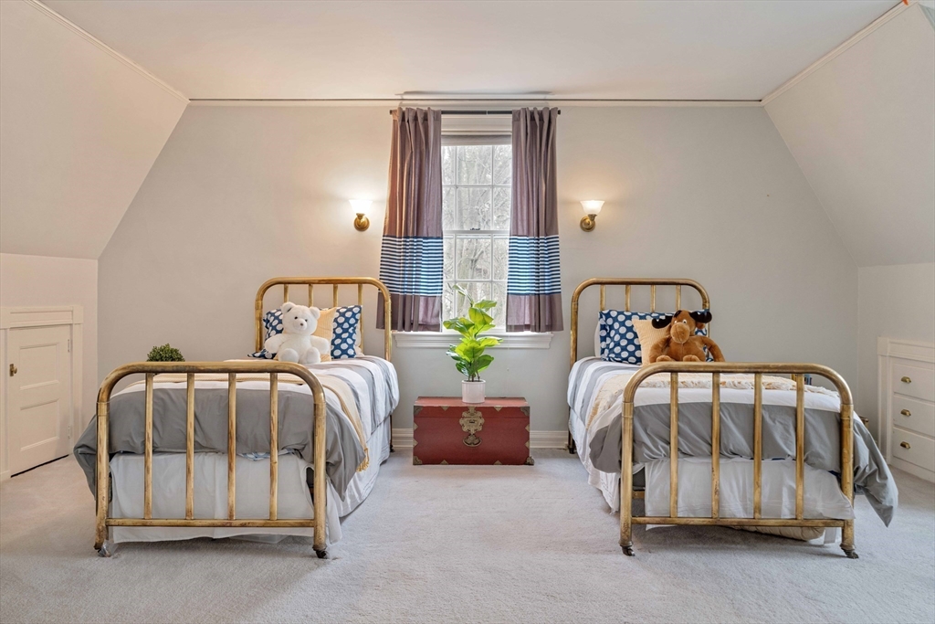 285 Clinton Road Brookline, MA 02245 - Photo 20 of 28 a bedroom with a bed and window