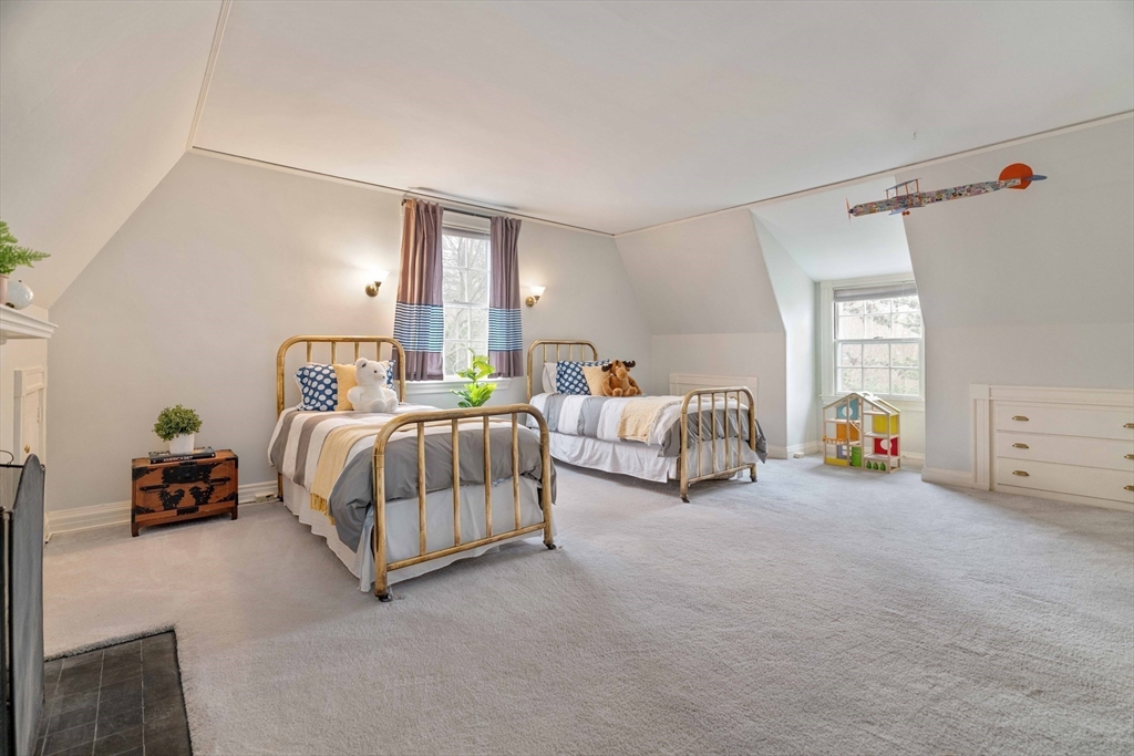 285 Clinton Road Brookline, MA 02245 - Photo 21 of 28 a bedroom with bed and a couch