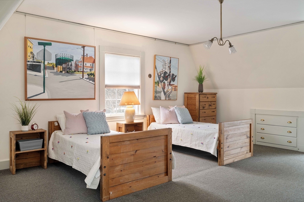 285 Clinton Road Brookline, MA 02245 - Photo 22 of 28 a bedroom with a bed and a couch