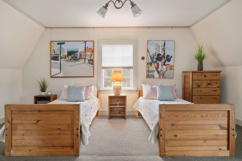 285 Clinton Road Brookline, MA 02245 - Photo 23 of 28 a bedroom with a bed and a dresser