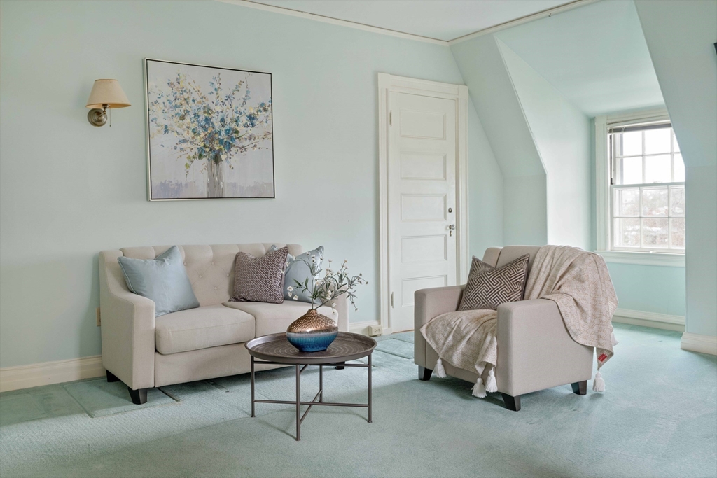 285 Clinton Road Brookline, MA 02245 - Photo 25 of 28 a living room with furniture and a window